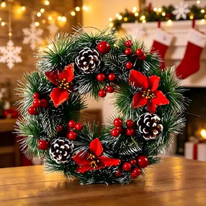 30cm Christmas wreath with artificial pine cones, red berries and red poinsettia flowers.