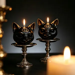 Handcrafted gothic black three-eyed cat scented candle on silver holder for Halloween decor