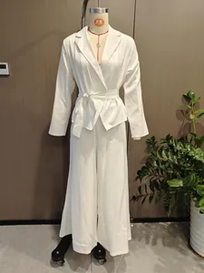 Full view of white long sleeve belted blazer and wide leg trousers set on a mannequin