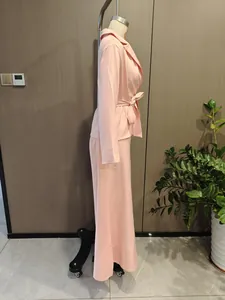 Elegant pink commuter two-piece set featuring a belted blazer and wide-leg trousers