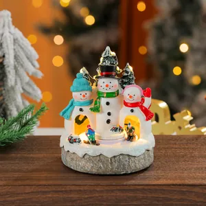 Glowing Christmas snowman family resin music box ornament with festive warm lights
