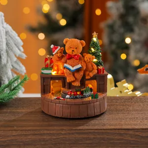Festive Christmas resin music box featuring rotating train and cute bear ornaments