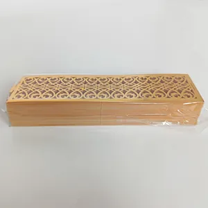 Detailed side view of stacked laser-cut gold napkin rings in clear plastic packaging