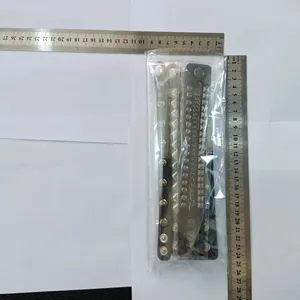4pcs punk style spiked leather bracelets shown with metal rulers for size reference