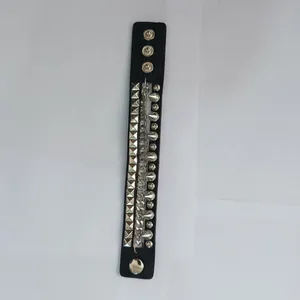 Punk style black leather bracelet featuring silver rivets and a metal chain detail.