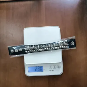 Detail showing the 28.0g weight of this punk rivet bracelet on a digital scale