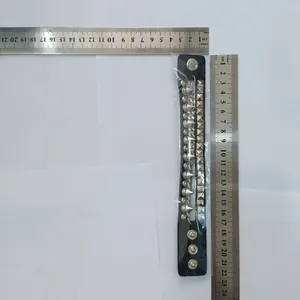 Measurement showing dimensions of a punk black leather bracelet with silver spikes