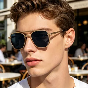 Detailed side view of premium gold metal square frame sunglasses on a stylish male model