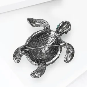 Back view detail of gunmetal turtle brooch showing the secure safety pin clasp mechanism