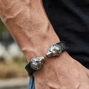 High-quality men's punk style black leather bracelet with detailed stainless steel lion heads