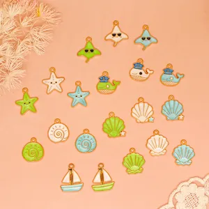 Detail view of ocean series alloy charms with colorful starfish and whale shapes.