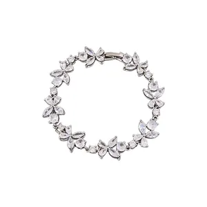 Elegant silver flower bracelet with sparkling cubic zirconia on a white background.