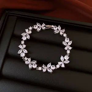 Close-up detail of French luxury floral zircon bracelet featuring sparkling clear stones
