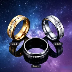 Detailed view of single row crystal inlaid stainless steel rings in gold, silver, black