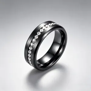 Detailed view of black brushed stainless steel ring featuring a row of inlaid stones.