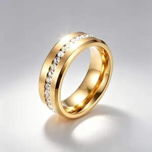 Highly detailed macro shot of gold stainless steel ring with single row of clear stones