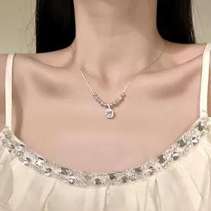 Detailed close-up view of elegant round zircon pendant necklace worn by a female model