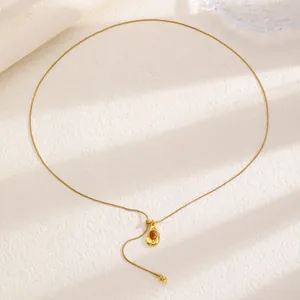 Elegant vintage gold chain necklace featuring a brown tiger eye stone teardrop pendant