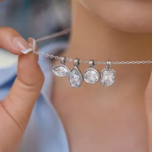 Close-up of ribbed bezel necklace with marquise, pear, round and square cubic zirconia