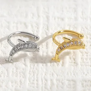 Pair of ocean-themed dolphin ear cuffs in gold and silver finish with sparkling zircon inlay