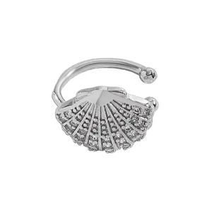 Detail view of silver-tone shell ear cuff featuring micro-set sparkling zircons.