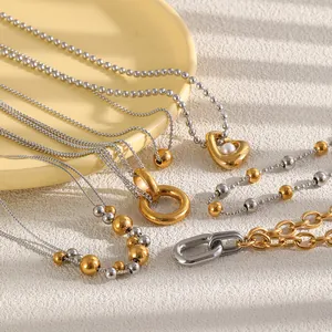 Colliers bicolores en acier inoxydable plaqué or 18 carats avec pendentifs cœur et anneau