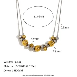 Vue détaillée du collier en acier inoxydable bicolore avec perles en or 18 carats