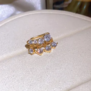 18k gold-plated ear cuff with sparkling cubic zirconia tassels on white display