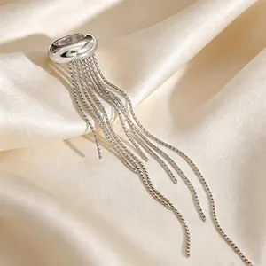 Close-up of a high-quality silver stainless steel ear cuff with long tassel chains