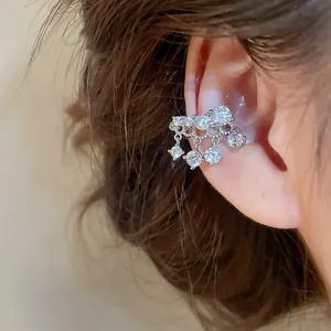 Detailed macro shot of sparkling cubic zirconia tassel ear cuff for non-pierced ears
