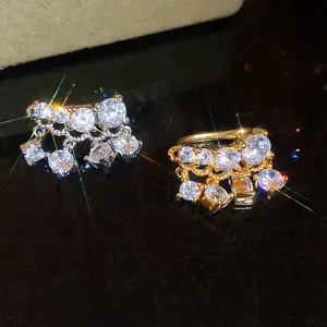 Detailed view of high-end 18k gold and silver plated ear clips with sparkling cubic zirconia