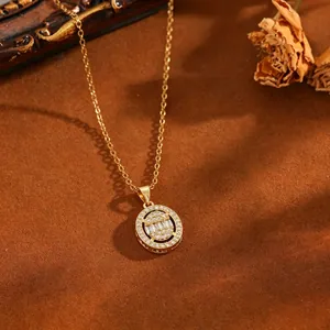 Close-up of gold stainless steel necklace with round sparkling zircon pendant