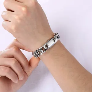 Detailed view of a silver titanium steel Cuban chain bracelet with a square flip clasp