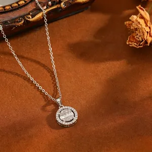 Close-up detail of a sparkling round pendant necklace with baguette and round cut stones