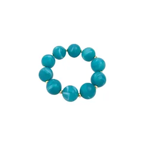 Summer dopamine style marbled turquoise acrylic beaded bracelet with elegant gold spacers