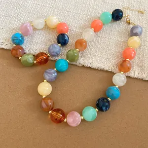 Close-up of colorful acrylic beaded necklace with dopamine design elements