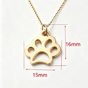 Detailed view of gold paw print pendant with 15mm by 16mm dimension markers