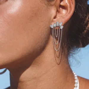 Elegant silver tassel earrings with sparkling zircons shown on model for a stylish luxury look