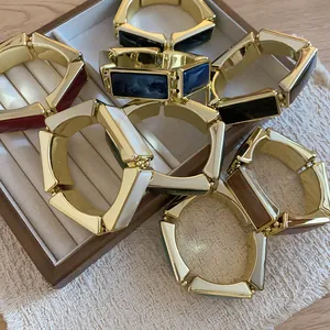 Collezione di eleganti bracciali elastici in resina e metallo dorato vari colori