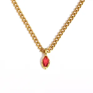 Detailed view of a gold stainless steel necklace featuring a red marquise zircon pendant.