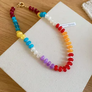 Close-up of colorful rainbow acrylic beaded necklace with translucent irregular beads