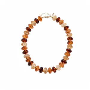 Elegant vintage acrylic marbleized beaded necklace in amber and cream tones for women