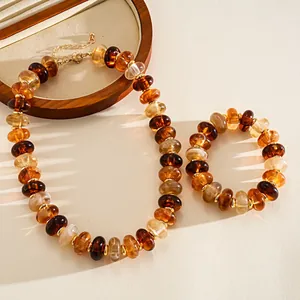 Detail view of retro amber acrylic marbled beads necklace and bracelet jewelry set
