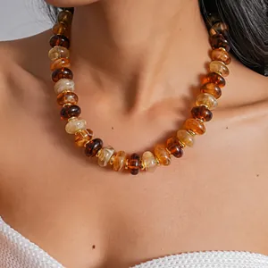 Detailed view of a colorful acrylic marbled bead necklace in retro fashion style