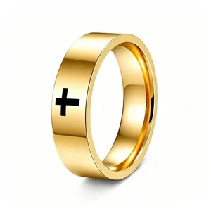 Close-up of a polished gold stainless steel ring featuring a black cross design.