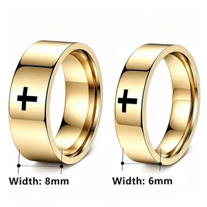 Detailed macro view comparing 8mm and 6mm gold stainless steel rings with black cross motif