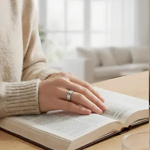 Detail view of a polished stainless steel ring with a cross design worn during reading