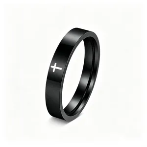 High-quality detail view of a black stainless steel ring featuring a white cross pattern