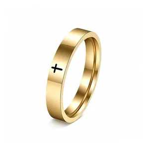 Detailed view of gold stainless steel ring with minimalist black cross engraving
