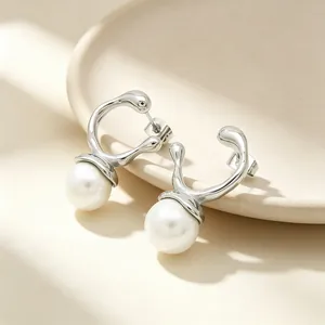 Elegant silver-toned irregular metal stud earrings with large round white pearls